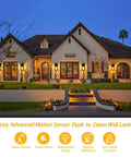House with 2 Pack Motion Sensor Outdoor Wall Lights Dusk To Dawn Matte Black Porch Lanterns illuminating entrance