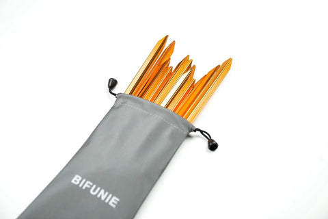 Ultralight 7 Inch Aluminum Tent Stakes 12 Pack With Reflective Pull Ropes Rock Solid Ground Pegs in gray pouch