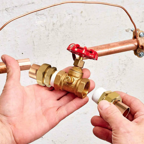 Hands holding Real Solid 3/4 Inch Brass Pipe Union Fittings Three Pack Copper To Male Thread Sweat Plumbing Connectors.