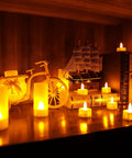 Rechargeable Flameless Tealight Candles Set 12 Pack With White Base And USB Charging Dock Flickering LED Tea Lights on shelf