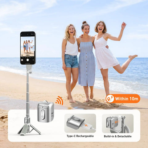 Phone Camera Grip With Selfie Stick Tripod Magnetic Mount And Detachable Wireless Shutter Button for iPhone, standing on beach.