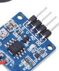 Close-up of a Piezoelectric Vibration Sensor Module with Adjustable Sensitivity and 5V DC Analog Output for Tapping Detection.