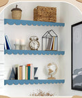 Natural Unfinished Scalloped Wood Trim With Wavy Edges And 10 Small Curves Per Piece perfect for room updates on blue shelves.