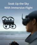 Avata 2 FPV Drone With 4K Camera, Immersive Goggles Experience flying near beach with person controlling and wearing goggles.