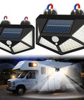 Magnetic Solar RV Light With Motion Sensor For Camper And Motorhome 100 LED Exterior Porch Light Waterproof Outdoor Trailer Light Easy No Drill Mount With 2 Strong Magnets 2 Pack shown illuminating a camper.