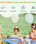 Family using blue picnic table cover with bench covers during outdoor celebration, product is Waterproof and Windproof, Camping Essentials