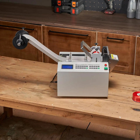 Automatic Heat Shrink Tube Cutting Machine Slick Cable Pipe Trimmer on wooden table, designed for accurate tube trimming.
