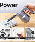 Person using Ultra Electric Air Duster Blower For PC And Electronics Cleanup on keyboard
