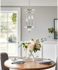 Modern Dope 3-Light Geometric Lantern Chandelier in Brushed Nickel Finish With Cylinder Trellis Cage And Crystal Orb Finial over dining table