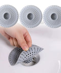 Top Shelf Silicone Hair Catcher For Bathtubs And Showers blocks debris with ease, showing installation in a sink.