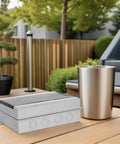 Solid Outdoor Waterproof Electrical Enclosure Box With Reinforced Ps Structure And Breaker Panel Cover on a patio table.