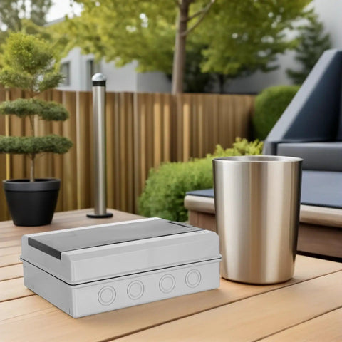 Solid Outdoor Waterproof Electrical Enclosure Box With Reinforced Ps Structure And Breaker Panel Cover on a patio table.