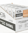 Premium 8 Inch Tapered Kiln Dried Cedar Wood Shims Bulk Contractor Case 560 Count visible in contractor box display.