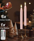 Pink Flameless Taper Candles Real Wax With Remote Timer 6 Pack 9.8 Inch LED Spiral 3D Wick on a table