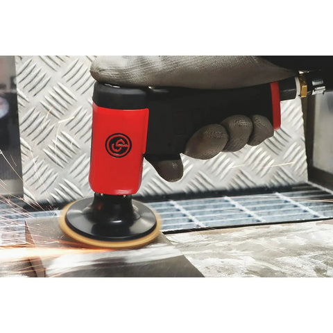 Air Rotary Sander Tool With Pistol Grip Handle 3 Inch Hook And Loop Pad 0.2 HP 150W 15000 RPM in action on metal surface