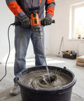 Worker using Corded 20 Amp Mixing Drill With Five Eighth Inch All Metal Chuck 1100 RPM Heavy Duty Concrete Mixer in a workshop