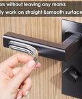 Straight Up Tough Wall Bumpers Eight Piece Pack Rock Solid Adhesive Keeps Furniture From Scuffing Paint Easy Peel And Stick Setup For Spaces That Deserve A Clean Look, clear bumper strip being applied to smooth surface.