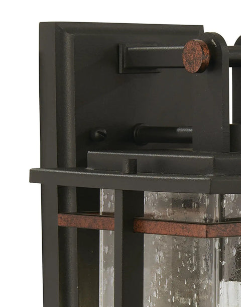 Close-up of Outdoor Wall Light With A Dope Black And Copper Finish, 11.25 Inches High, featuring clear glass panels and metal frame.