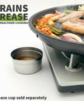 Korean BBQ Nonstick Grill Pan For KBBQ Lovers, Cast Aluminum Build, PFOA Free Coating with grease draining into a cup