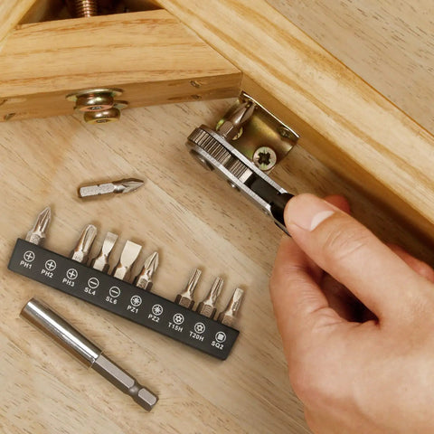 Hand using Tiny But Mighty Mini Ratchet Set 12 Piece One Quarter Inch Drive Right Angle Screwdriver Kit for tight space