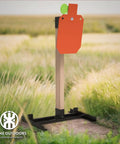 Heavy Duty AR500 Steel Hostage Target Stand System, Twelve By Twenty Inch Target, Three Eighths Inch Thick Steel, Includes Two By Four Extendable Paper Target Stand Kit, Ground Stakes And Hanger Set For Stable Outdoor Target Practice Range Ready in a field.