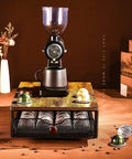 Wood And Iron Coffee Pod Holder Organizer For Drawer displaying coffee grinder on top with pods, ideal for kitchen storage.