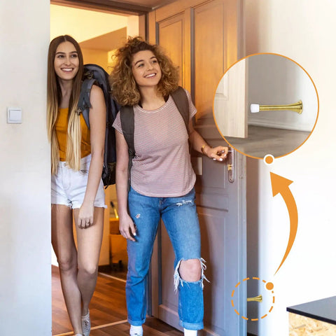 Two people entering a room; inset shows Spring Door Stoppers 12 Pack Wall Protectors For Inside Doors With 6 Rubber Bumpers Gold Finish Elastic Steel Spring Design Keeps Doors From Slamming Dents Ideal For Home And Office installed on the wall.