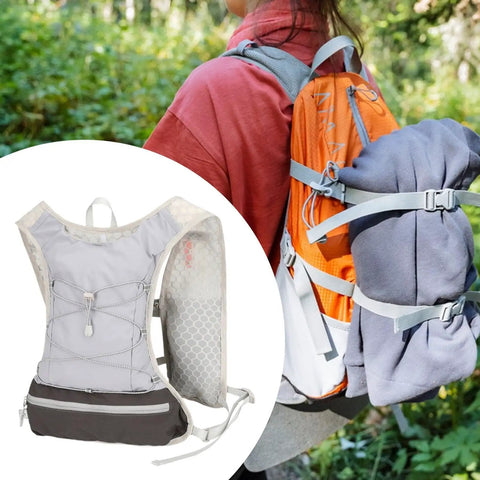 Go To Lightweight Hydration Running Backpack With Breathable Vest, shown in use, adjustable straps and reflective strips visible