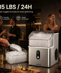 Top Tier Countertop Nugget Ice Maker Churns Out 35 Pounds Of Chewable Pebble Ice In Just Seven Minutes With Self Cleaning Design And Removable Basket For Everyday Chill Sessions In Silver, with ice being scooped.