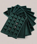 Top Tier PU Leather Jewelry Display Tray Featuring Twenty Four Secure Grid Slots For Rings Earrings And Brooches, dark green color, showcasing earrings.