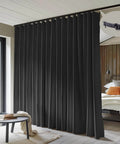 100 Percent Blackout Room Divider Curtains With Ceiling Track Set installed in room, showing floor to ceiling black drape.