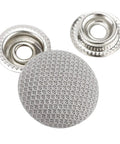 Close-up of metal snap rivets and grey fabric button from 60 Piece Universal Car Roof Headliner Repair Kit With Installation Tool