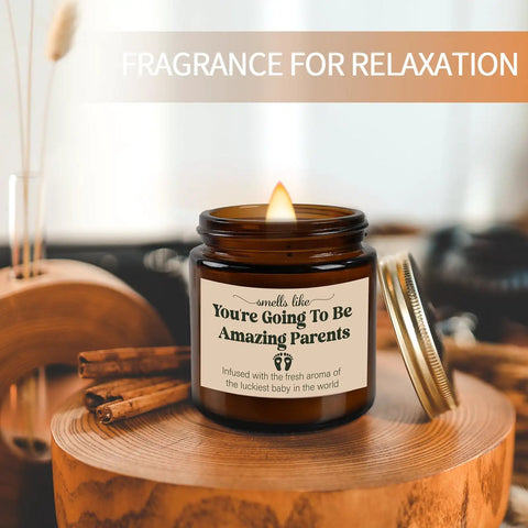 Celebrate The Freshly Minted Arrival Of New Mama And Papa With This Awesome Gift Set For Couples Featuring Matching Tumblers Paired With A Warm Cozy Candle Perfect For Baby Showers First Fathers Day And Parenting Squad Celebrations. Brown candle labeled 'You're Going To Be Amazing Parents' on a wooden table.
