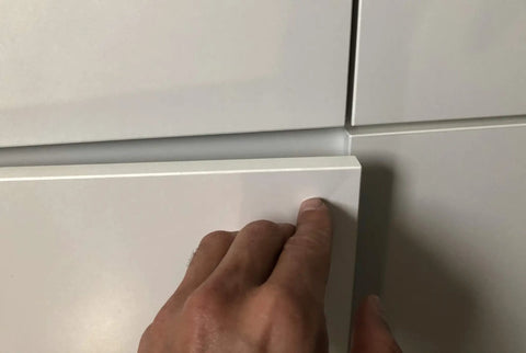 Person pressing on a white cabinet door with Super Slick Push To Open Cabinet Latches With Strong Magnet Set Of 3 Silver Touch Release Handles For Kitchen Cupboards And Drawers Quick Install Kick Open Hardware.