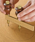 Heavy Duty Adjustable Trammel Points Set With Smooth Hardwood Handles And Precision Pencil Leads For Knockout Circle Layouts And No Hassle Arc Marking That Fits Dead Square On Shop Beams in use on wood.