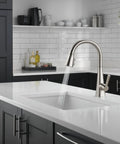 Crisp Brushed Nickel Kitchen Faucet Featuring Heavy Duty Pull Down Sprayer, single handle control, minimalist design in modern kitchen.