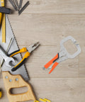 Heavy Duty High Carbon Steel C Clamp Locking Pliers on a workbench with tools, ideal for woodworking and welding jobs.