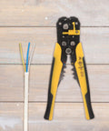 Kickass Heavy Duty Auto Wire Stripper And Crimping Pliers Pro Gear For Electricians with yellow grip and wire strands.