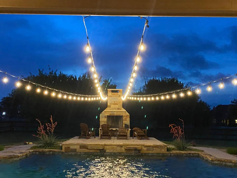 52 Ft Outdoor String Lights With 30 Incandescent Bulbs UL Listed Commercial Quality Edison Patio Cafe Market Lights hanging over patio