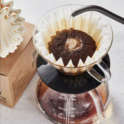 Large Flat Bottom Coffee Filters Tall Walled 9.75 Inch Wide 4.25 Inch Tall 2.75 Inch Sides 300 Count Compatible With BUNN And 12 Cup Home And Commercial Coffee Makers Durable Pulp Paper For Your Daily Cup Of Joe in a drip coffee brewer with water being poured over grounds.