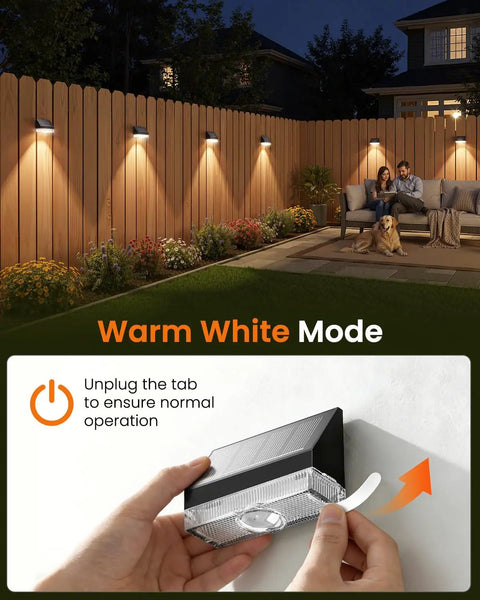 Kick It Up A Notch With This 8 Pack Of Solar Fence Lights Delivering A Cozy Warm White Glow Automatic Dusk To Dawn Switchout Mounted on a wood fence.