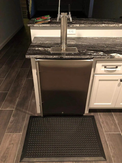 Heavy Duty Rubber Door Mat 36 By 24 Inches Grippy Non Slip Drainage Floor Mat in front of a bar counter indoors