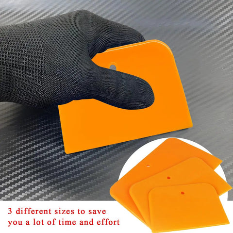 Gloved hand holding Six Pack Body Filler Spreaders Set 4 5 6 Inch Reusable Plastic Auto Body Spreader Tools For Applying Filler Putty Glaze
