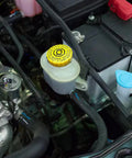 Pro Grade Brake Main Cylinder Cap Replacement For Automotive Brake System, Leak Proof, Durable, Easy Install, Fits Multiple Vehicles, Reliable Spare Part For Car Enthusiasts And Pros, yellow reservoir cap on engine bay brake master cylinder