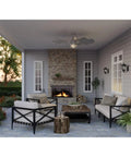 Chic Slick Farmhouse Ceiling Fan With A Tough Antique Nickel Finish And Massive Twelve Blade Windmill Design For That Fresh Modern Rustic Vibe Inside Open Living Spaces in a patio setting.