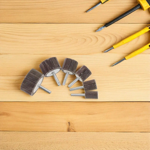 Top Notch 12 Pcs Flap Wheel Assortment With Shank For Die Grinder And Bench Buffers Super Abrasive Polishing Heads shown on wood surface.
