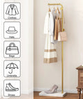 Gold Metal Coat Rack With 3 Hooks, L Shaped Freestanding Coat Tree in a room with coats and bags hanging