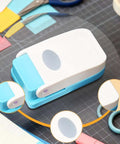 Dope Tiny Paper Punch Hole Puncher For Scrapbooking And Photo Albums, Oval Shape, Acrylic And Metal Cutter on crafting table
