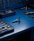 Grease Gun Coupler Tips 2 Pack For Cars And Industrial Jobs, Steel Build, Pro Grade Precision Flow, shown on blue workbench
