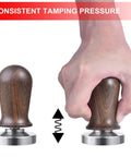 53mm Calibrated Espresso Tamper With Spring Loaded Wooden Handle And Stainless Steel Flat Base For Consistent Extraction in hand